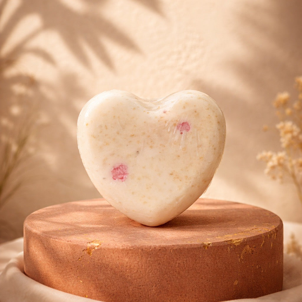Heart-shaped soap on a wooden stand with a soft, blurred background